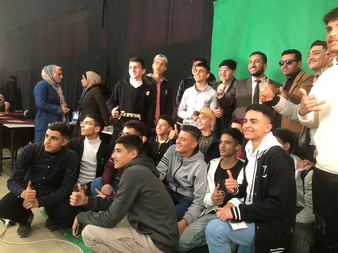 Oday with his school community in Gaza.